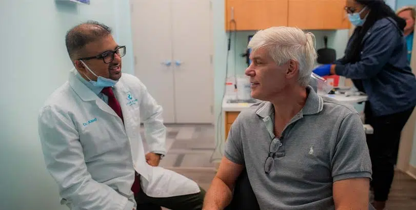 Dr. Ahmed speaking with a patient